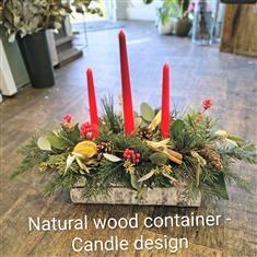 Candle arrangement in wooden log 